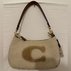 Hello! I’m Selling A Small Coach Terri Sherpa Crossbody Bag. The Brand Is Coach. Color Beige & Brown. Never Used. Paid $230 Ask $150 Obo. Size 9.5”(L) X 6”(H) X 3” (D). Coach Bags, Small Bags, Crossbody Bag, 3 D, Bag Lady, Women Shopping, Color