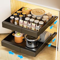 an open drawer with pots and pans on it