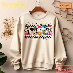 mickey mouse and friends sweatshirt hanging on a wall