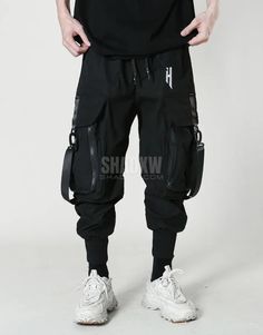 Type: Techwear pants Design: Techwear, streetwear Technical pants: This techwear pants is the perfect garment to complete your Techwear outfit. Premium quality: Reinforced seams, comfortable to wear, soft touch Materials: Polyester Suitable for men and women Machine washable: 30 °C (86 °F) Size(cm | in) Waist Hip Length S 66 | 26 106 | 41.7 94 | 37 M 70 | 27.5 110 | 43.3 96 | 37.8 L 74 | 29.1 114 | 44.8 98 | 38.5 XL 78 | 30.7 118 | 46.5 100 | 39.4 2xL 82 | 32.2 122 | 48 102 | 40.1 Cyberpunk carg Techwear Joggers With Side Pockets, Black Cyberpunk Cargo Pants For Streetwear, Black Techwear Cargo Pants For Sports, Techwear Style Cargo Pants For Streetwear, Cyberpunk Black Pants For Outdoor, Black Cyberpunk Pants For Outdoor, Functional Black Sweatpants For Streetwear, Techwear Baggy Sweatpants For Streetwear, Baggy Techwear Sweatpants For Streetwear