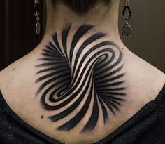 a woman with a black and white tattoo on her back neck is looking at the camera