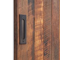 a close up of a wooden door with a metal handle on the front and side