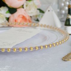 a close up of a plate with pearls on it