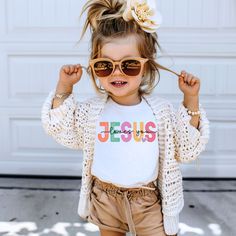 Let your little one wear their faith with pride in our "Jesus Loves You" toddler t-shirt. Soft and playful, this shirt is a sweet reminder of the boundless love that surrounds them every day. Made with 100% Airlume combed and ring-spun cotton Bella+Canvas Toddler sizing This product is made especially for you as soon as you place an order, which is why it takes us a bit longer to deliver it to you. Making products on demand instead of in bulk helps reduce overproduction, and most orders are printed and shipped within 2-7 days of ordering. Thank you for making thoughtful purchasing decisions! 2T 3T 4T 5T Width, in 12.00 13.00 14.00 15.00 Length, in 15.50 16.50 17.50 18.50 Graduation Shirt, Style Kawaii, Ride Or Die, Cozy Sweatshirts, School Shirts, Kids Tops, Shirts For Girls, Lay Flat, Tennessee