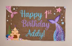 a birthday banner with an image of a mermaid