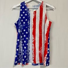 an american flag tank top hanging on a hanger