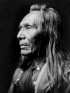 an old native american man with long hair