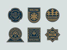 four badges for the revelstone logo, with gold and black designs on them