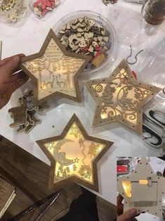 someone is working on some star shaped decorations