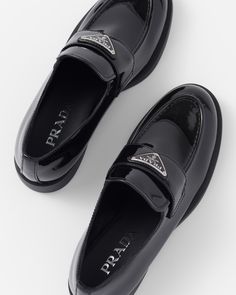 Upper with leather band Enameled metal triangle logo Rubber monoblock sole with hot-stamped logo 25 mm heel Prada Black Loafers, Prada School Shoes, Prada Loafers Aesthetic, Patent Loafers Outfit, Prada Loafers Women Outfit, Prada Shoes Women, Black Prada Shoes, Loafers Aesthetic, Woman Loafers