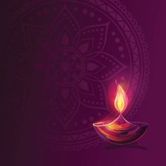 a colorful lit candle on a purple background