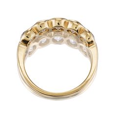 The Allure 1.60 band is an AB original design made right here in NYC! This ring features 6 Old Mine Cut diamonds that combine for approximately 1.60 carats and are half bezel-set in our signature 18kt yellow gold setting. The diamonds are approximately J-K-L in color, VS-SI in clarity. The ring is currently size 5.75 and can be resized! Why We Love It This sleek and chic finger-spanning band features chunky antique diamonds encased in a gold bezel, for the perfect blend of old meets new. Gold Marquise Cut Diamond Ring With Bezel Setting, Luxury Cubic Zirconia Diamond Ring With Bezel Setting, Bezel-set Baguette Cut Diamond Ring, Yellow Gold Baguette Cut Diamond Ring With Bezel Setting, Baguette Cut Diamond Ring With Bezel Setting, Timeless Cubic Zirconia Diamond Ring With Bezel Setting, Luxury Bezel Set Diamond Ring For Anniversary, Luxury Diamond Ring With Bezel Setting For Anniversary, Luxury Gold Diamond Ring With Bezel Setting