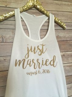 a white tank top that says just married with gold sequins on the side