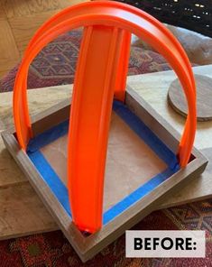 an orange object sitting on top of a wooden table