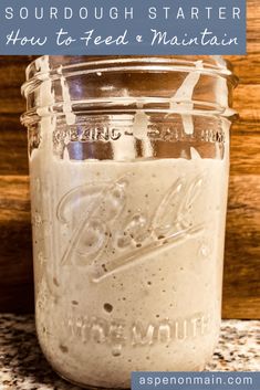 a mason jar filled with sourdough starter how to feed and maintain