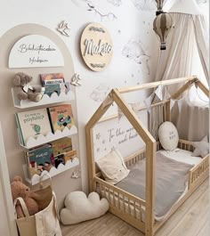 a child's room with a doll house bed and bookshelf