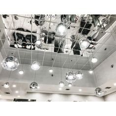 the ceiling is filled with shiny disco balls