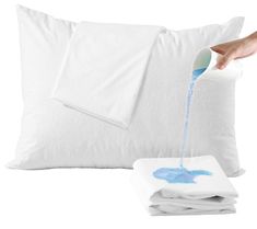 a person pouring blue liquid into a white pillow