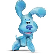 an inflatable blue dog toy sitting on the ground