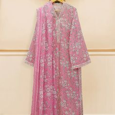 Pink Color Cotton Material New Elegant V-neck Floral Print Kurta, Cotton Party Dresses For Eid, V-neck Floral Print Dress For Eid, Elegant Cotton Dresses For Eid, Feminine Floral Print Festive Dresses, Elegant Pink Lawn Suit With Long Sleeves, Feminine Dresses For Eid, Festive Feminine Floral Print Dresses, Feminine Pink Festive Dress