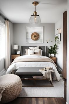 a bedroom with gray walls and white bedding