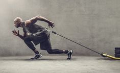 a man running with a stick in his hand