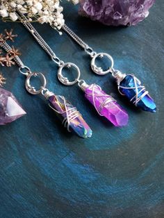 "Witchy moon quartz crystal necklace with your choice of quartz color - AB Peacock, AB Pink, AB Blue. Necklace comes on stainless steel chain suitable for those with allergies. Clasp is high quality 304 stainless steel and measures 8x13mm. ➳ Moon charm is 20mm ➳ Chain length is 18\" - total length is approximately 22\" ➳ All components are lead and nickel free ➳ Please note the size, color and shape of crystal will vary slightly due to natural inconsistencies ̩̩͙✩*̩̩͙*˚＊ ̩̩͙✩*̩̩͙*˚＊ ̩̩͙✩*̩̩͙*˚＊ Magical Wire Wrapped Crystal Necklaces For Gifts, Magical Wire Wrapped Crystal Necklaces As A Gift, Magical Wire Wrapped Crystal Necklace Gift, Spiritual Wire-wrapped Metal Crystal Necklace, Nickel Free Metal Crystal Necklace For Gifts, Nickel-free Metal Crystal Necklace For Gift, Spiritual Metal Crystal Necklaces As Gift, Mystical Silver Crystal Necklace For Gifts, Spiritual Metal Crystal Necklace With Round Pendant