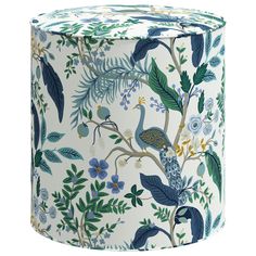 a blue and white floral print drum lamp shade with birds on the tree branch, surrounded by leaves and flowers