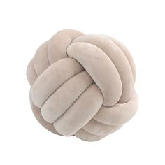 a round pillow with multiple braids on it's sides and one knoted in the middle