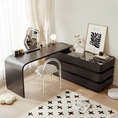 a black and white living room with two tables on the floor, one has a mirror above it