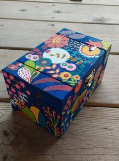 a colorful box sitting on top of a wooden table