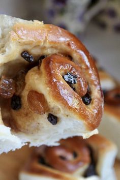 a close up of a pastry with raisins on it