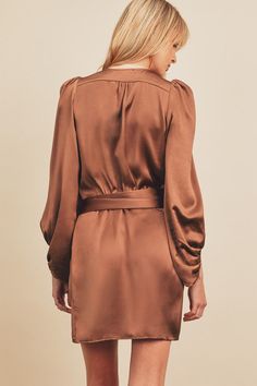 This Satin mini-dress featuring a wrap style with sash tie closure at waist. Long puff sleeve has pleating details on the shoulders. poly/rayon satin Beautiful Mini Dresses, Satin Wrap Dress, Shoulder Wrap, Wrap Mini Dress, Dress Sash, Pleated Sleeves, Satin Mini Dress, Long Puff Sleeves, Mini Wrap Dress