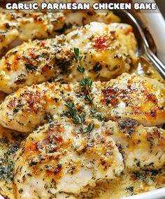 a close up of chicken in a pan with sauce and herbs on the top, text reads garlic parmesan chicken bake