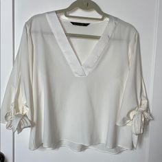 Zara Semi Sheer White, Flared Sleeve With Adjustable Tie Detailing, V-Neck Blouse. Never Worn. Nwt. Elegant V-neck Blouse For Summer, Chic White V-neck Top For Day Out, Spring Top With Notched Neckline For Day Out, Elegant V-neck Blouse For Brunch, Elegant V-neck Top For Day Out, White V-neck Top For Spring Workwear, Elegant V-neck Summer Tops, Chic Spring Blouse With Notched Neckline, Chic Spring Top With Notched Neckline