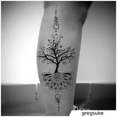 a woman's leg with a tree on it and words written in the middle