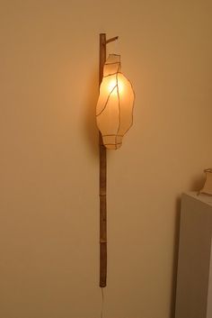 a lamp that is on the side of a wall