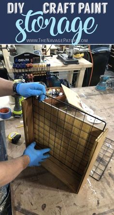 a person in blue gloves working on a piece of wood with text overlay that reads diy craft paint storage