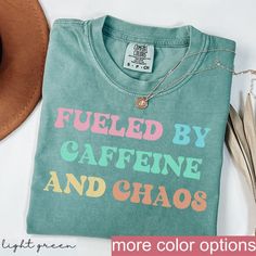 Fueled by Caffeine and Chaos Shirt - Funny Mom Tee - Relatable Coffee Lover Shirt for Busy Moms PRODUCTION AND SHIPPING  Production: 1-3 days Standard Shipping (3-5 business days after production time) T-shirts and Sweatshirts are professionally PRINTED they are the highest quality print possible, like the quality you would expect from a retail shop bought T-shirt.  HOW TO ORDER YOUR CUSTOM DESIGN T-SHIRT  * Choose your t-shirt color * Choose your size * Choose your design & text color We absolutely love customizing orders for people! The best feeling is being able to add a personal touch to our designs to make our customers happy. If you would like to tweak this design with a name on the back or add some additional text all you have to do is add this listing to your cart with the shirt as Coffee Mom Shirt, Fun Mom Shirts, Chaos Funny, Caffeine And Chaos, Mom Tees Funny, Relatable Mom, Mom Life Funny, Funny Mom Shirt, Coffee Lover Gift