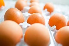 several eggs are lined up in an egg carton