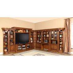 a large entertainment center with built in shelves