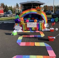 a car is decorated with rainbows and decorations