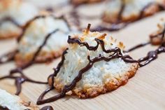 chocolate drizzled on top of some cookies