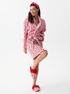 Add a festive and luxurious touch to your loungewear with Shiraleah’s Felicity Candy Cane Robe. The adorable light pink robe features a pattern of red striped candy canes tied with a green bow - perfect to wear while you open up presents by the tree. This soft and fuzzy robe features two front pockets and an adjustable wrap around belt, allowing you to be cozy and casual throughout your holiday celebrations. Pair with the matching Felicity Candy Cane Slippers, or other items from Shiraleah’s Mer Red Spring Robe For Loungewear, Fuzzy Robe, Fuzzy Fabric, Spa Wraps, Opposite Colors, Red Slippers, Red Fur, Soft Red, Green Bows