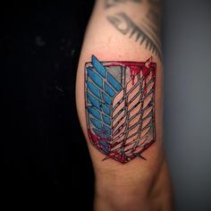 a tattoo on the arm of a person with a red, white and blue design