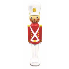 a red and white nutcracker figurine on a white background