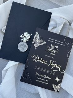 two black and white wedding cards with silver butterflies on them, one is for the bride