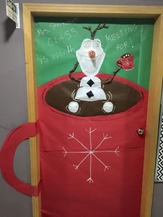 a classroom door decorated with an image of a santa's sleigh