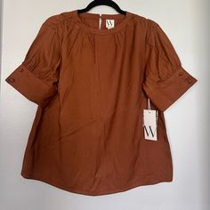 Rusty Brown (Tortoise Brown On Tag) Never Worn Button Sleeves 50% Rayon 50% Polyester Pet And Smoke Free Brown Workwear Tops With Button Closure, Brown Button Closure Tops For Work, Brown Tops With Button Closure For Work, Brown Buttoned Blouse For Work, Brown Blouse With Buttons For Workwear, Fall Short Sleeve Blouse With Button Cuffs, Casual Brown Blouse With Button Cuffs, Brown Blouse With Button Cuffs, Brown Summer Workwear Blouse