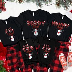 Enjoy the Christmas Family Celebrations with these unique and fun Christmas Shirts for you and your loved ones. There are 5 different sayings on each shirt, and they can chosen in green or black to emphasize the Christmas Spirit! Unisex T-shirt - 100% Airlume combed and ring-spun cotton - Soft cotton and quality print make users fall in love with it over and over again. - These t-shirts have ribbed knit collars to bolster shaping. - Printed and shipped from the USA CARE INSTRUCTIONS - Wash insid Fun Christmas T-shirt For Holiday, Funny Print T-shirt For Christmas Gift, Family Matching Holiday T-shirt With Letter Print, Playful Red Christmas Tops, Family Matching Letter Print Holiday Tops, Family Matching Holiday Tops With Letter Print, Family Matching Winter Tops For Gifts, Funny Christmas Holiday Tops, Black Christmas Tops With Letter Print